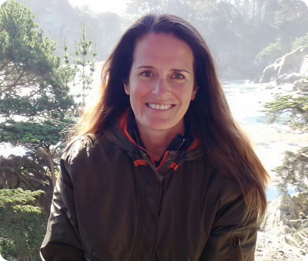 Woman smiling in outdoor setting